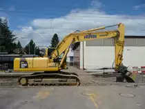 Bagger Komatsu PC 240 NLC in T�uffelen beim Bahnhofumbau am 09.08.2011