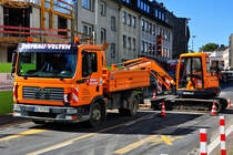 MAN Kipper und Kleinbagger KX-161-3 auf einer Baustelle in Bonn - 14.09.2011