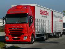 Iveco Stralis 420 Tandem-Hngerzug von  Schroth Paletten AG  aus der Schweiz abgestellt in Crailsheim, 23.10.2011