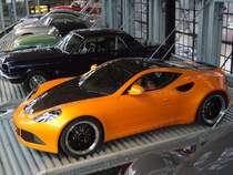 Artega GT. Dieses zweisitzige Sportcoupe wird seit 2010 bei der Artega GmbH & Co.KG im westflischen Delbrck produziert. Als Antrieb dient 3.6l 6-Zylindermotor aus dem Volkswagenregal, der im Wagenheck verbaut ist. Classic Remise Dsseldorf am 26.02.2012.