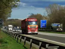 MAN mit Containersattelauflieger am 11.04.2012 auf der A4 zwischen Aachen Zentrum und Laurensberg, der letzten Abfahrt vor der Grenze zu den Niederlanden.