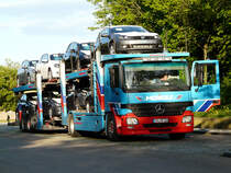 MB Actros MP2 1844 Autotransporter von  Mosolf  bei einer kurzen Pause auf der Rastanlage Frankenhhe, 04.05.2012