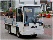 Elektromobil der Marke Mafi im Einsatz als Transportfahrzeug mit Baumaterial, aufgenommen auf Wangerooge am 07.05.2012.
