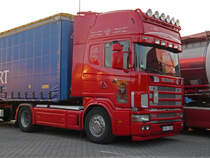 Scania 164L 580 aus Lettland mit einem sch�nem Tiger auf der Beifahrert�r. Gesehen auf dem Rasthof Feuchtwangen am 17.05.2012