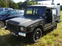 VW Typ 183 (Iltis). 1978 - 1988. Da der gel�ndeg�ngige Wagen, der als Nachfolger f�r den MUNGA enwickelt wurde, bei Audi konstruiert und produziert wurde, tragen einige Iltis die Audi Ringe auf der K�hlermaske. Aufgrund der angebrachten Flagge unterhalb der Frontscheibe, k�nnte es sich um ein ehemaliges, niederl�ndisches Milit�rfahrzeug handeln. M�lheim an der Ruhr am 16.09.2012.