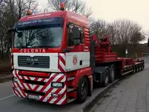 MAN Sattelzugmaschine der Firma Colonia aus K�ln am 11.01.2013 mit Kontergewichten f�r einen Kran auf dem Auflieger am neuen Campus in Aachen.