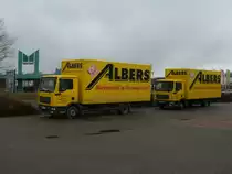 Zwei MAN Kasten-LKW,am 13.April 2013,in Greifswald.