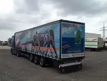 Bier Harlos LKW aus Bremerhaven mit einem MAN-TGA wirbt f�r die Fishtown-Pinguins Icehockey-Mannschaft. Das Bild entstand am 8.5.2013 auf einem Abstellplatz in Bremerhaven. ( Heckansicht )

