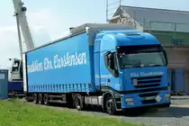Iveco Stralis als Sattelzug der Spedition Carstensen steht im 36100 Petersberg-Marbach zu Entladung, August 2013