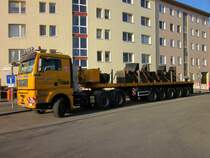 MAN TGA 33.530 mit 5-Achsigem Schwertransportauflieger am 10.03.2014 in Berlin-Charlottenburg. Beladen ist das Fzg. mit Gegengewichten für einen Kran.