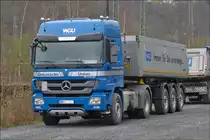 .  Mercedes Benz Actros 1846 mit Kipperauflieger abgestellt auf einem Parkplatz.  24.03.2014