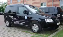 VW Caddy vom Autocenter Burgenland auf einem Parkplatz in Schwerin, August 2014