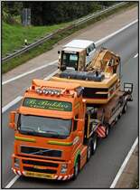 Ein Volvo FH transportiert einen CAT Bagger durch das Sauerland in Richtung Ruhrgebiet. Der LKW gehrt der  Holtrop van der Vlist Gruppe  Die Firmen Holtrop (Assen), Zwaar Transport Twente (Rijssen), Dabekausen (Born), und Cheron (Kappelen/Belgien) gehren diesem Unternehmen an.
Ende der 1960er Jahre spezialisierte man sich auf Spezial- und Schwertransporte und ist heute weltweit unterwegs.
Mit ihren Tochterunternehmen bieten sie logistische Gesamtlsungen im Spezial- und Schwertransport an.
Die  Van der Vilst Gruppe  besitzt in den Hfen von Rotterdam und Zeebrugge eigene Terminals bzw. eigene Umschlageinrichtungen. 
Das Unternehmen besitzt in ganz Europa ca. 350 bis 400 Fahrzeuge.